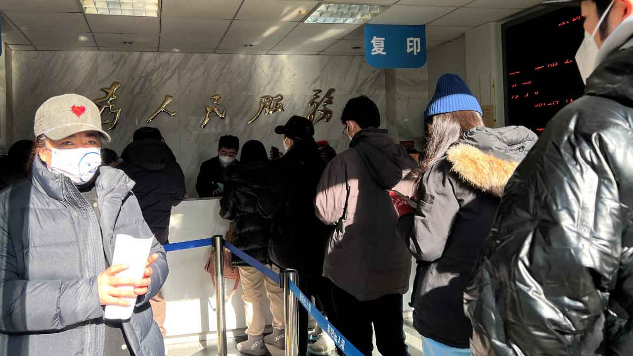 Chinese citizens eager to renew passports after China drops border controls