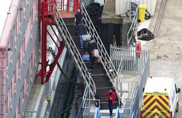 UK government rejects claims it was slow to evacuate asylum seekers after bacteria detected on barge-