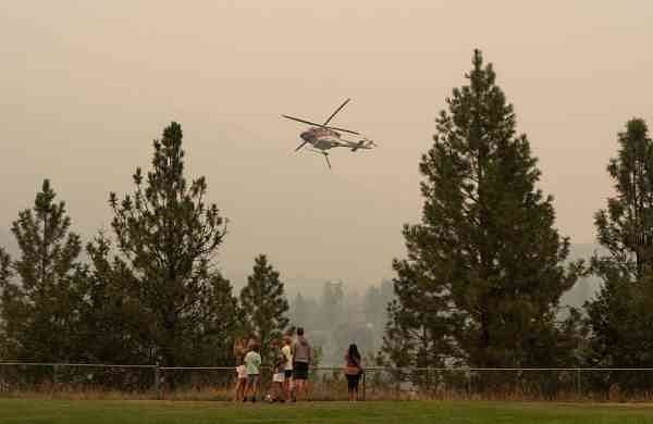 Western Canada wildfires force tens of thousands to flee-