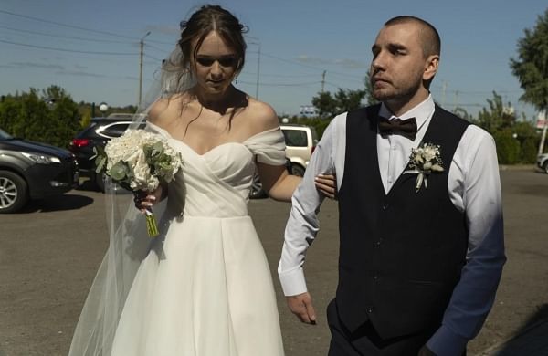 Blinded by Russian mortar shell, Ukrainian veteran couldn’t see his bride but wept with joy for new-