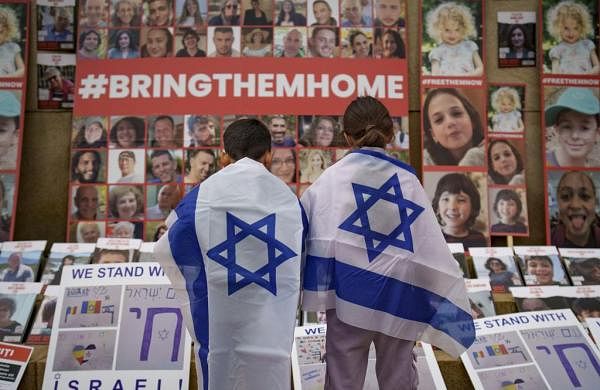 Families of Israel hostages fear the world will forget. So they’re travelling to be living reminders-