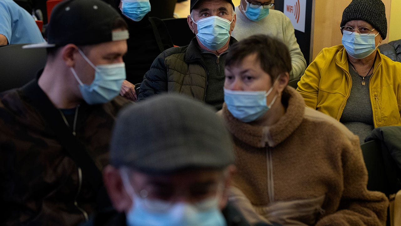 Spain makes face masks mandatory in hospitals and clinics after illness spike